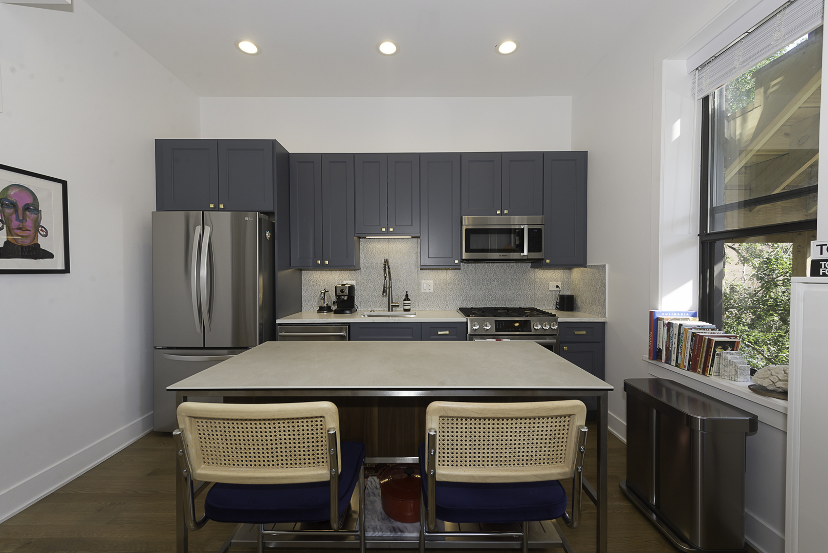 3517 North Reta Avenue, Unit 3R Chicago, IL 60657 - Photo 4 of 9 a kitchen with stainless steel appliances a stove refrigerator sink and cabinets