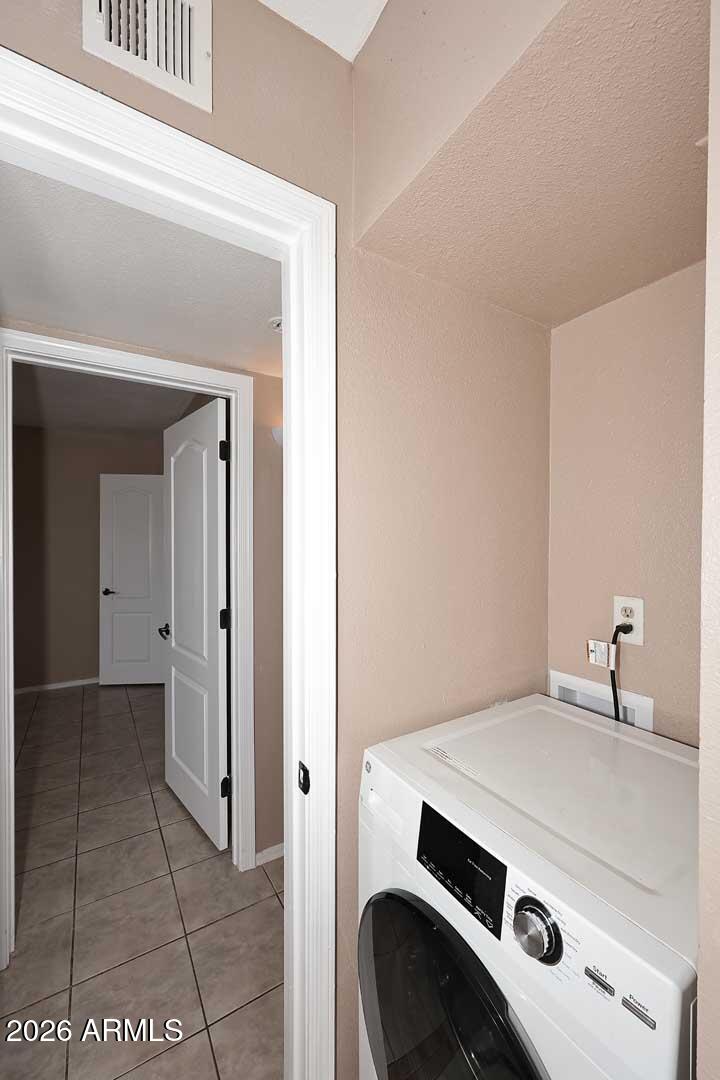 303 North Miller Road, Unit 1007 Scottsdale, AZ 85257 - Photo 26 of 45 a utility room with dryer and washer