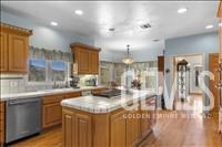 Undisclosed Address Tehachapi, CA 93561 - Photo 18 of 39 a kitchen with a sink cabinets and wooden floor