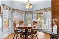 Undisclosed Address Tehachapi, CA 93561 - Photo 19 of 39 a view of a dining room with furniture window and wooden floor