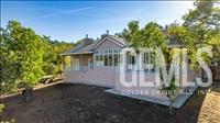 Undisclosed Address Tehachapi, CA 93561 - Photo 2 of 39 a front view of a house with a yard