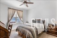 Undisclosed Address Tehachapi, CA 93561 - Photo 22 of 39 a bedroom with a bed next to a window