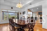 Undisclosed Address Tehachapi, CA 93561 - Photo 9 of 39 a view of a dining room with furniture window and wooden floor