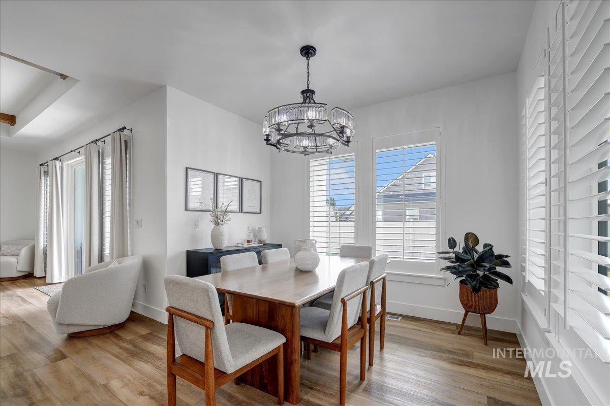 2078 Red Rock Way Twin Falls, ID 83301 - Photo 12 of 49 Dining area featuring a chandelier and light wood-type flooring