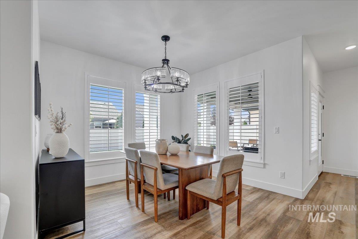 2078 Red Rock Way Twin Falls, ID 83301 - Photo 13 of 49 Dining room with a chandelier, healthy amount of natural light, and light wood-type flooring