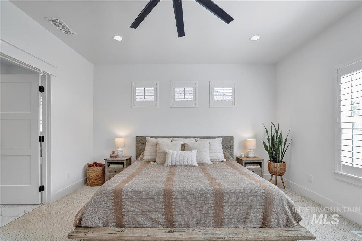 2078 Red Rock Way Twin Falls, ID 83301 - Photo 25 of 49 Bedroom featuring multiple windows, a ceiling fan, recessed lighting, and carpet