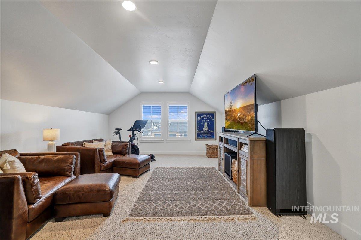 2078 Red Rock Way Twin Falls, ID 83301 - Photo 34 of 49 Living area with light colored carpet, lofted ceiling, recessed lighting, and a fireplace