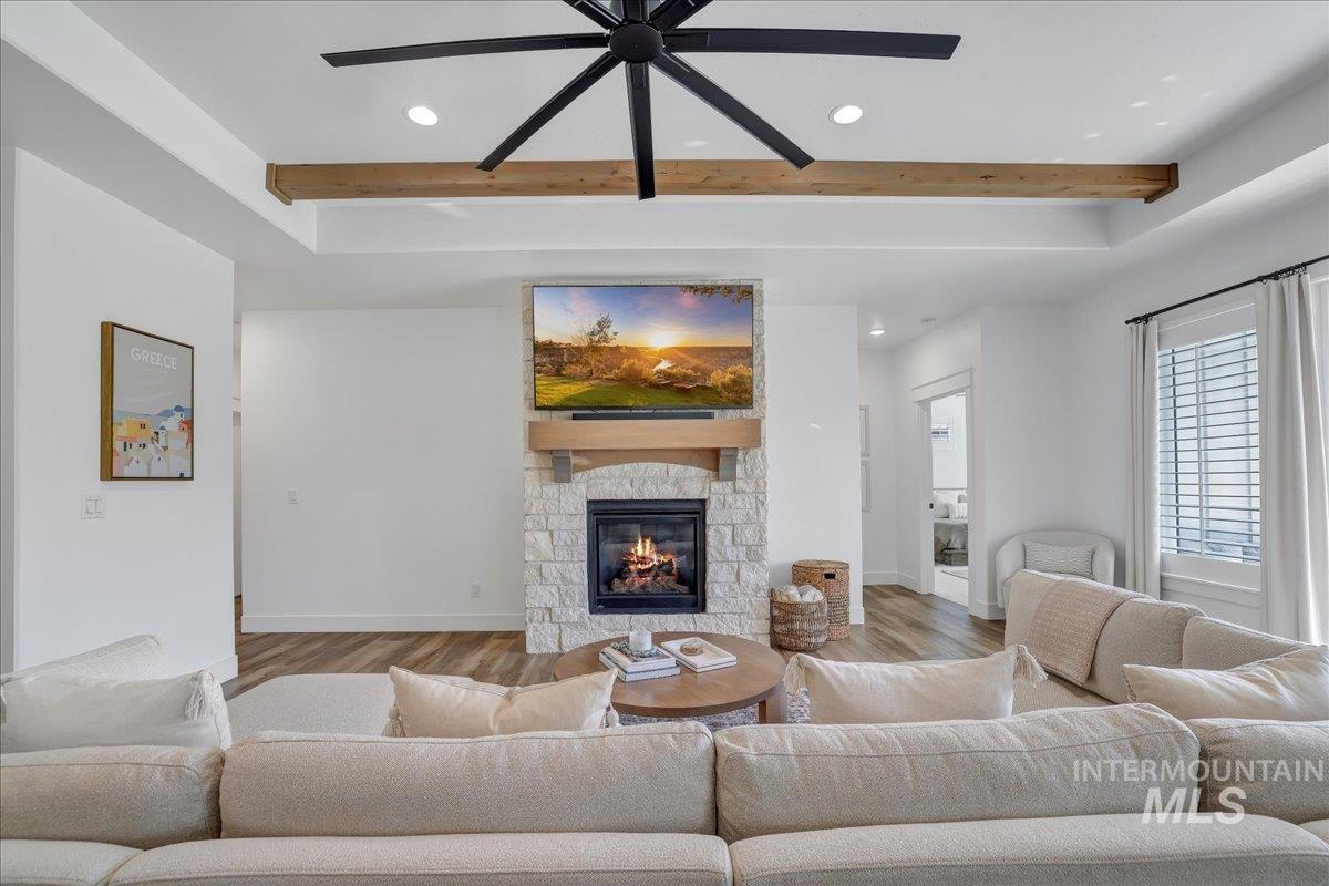 2078 Red Rock Way Twin Falls, ID 83301 - Photo 6 of 49 Living room with recessed lighting, beamed ceiling, wood finished floors, a ceiling fan, and a fireplace