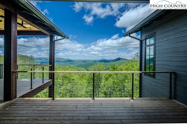 a view of balcony with wooden floor