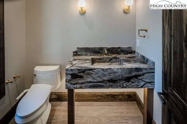 a bathroom with a toilet and a sink