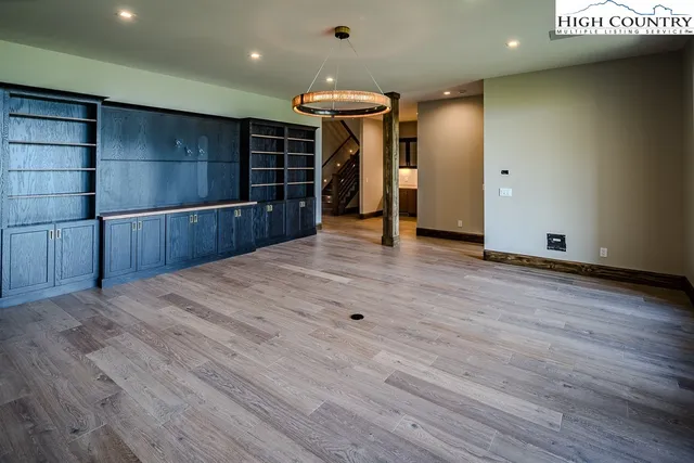 a view of a livingroom with an empty space and a window