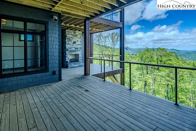 a view of balcony with wooden floor