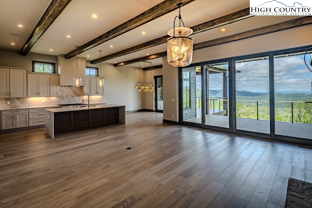 2005 Moon Run Linville, NC 28646 - Photo 3 of 37 a view of a kitchen with a sink and wooden floor