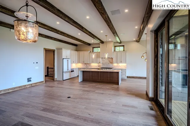 a view of kitchen with cabinets and wooden floor