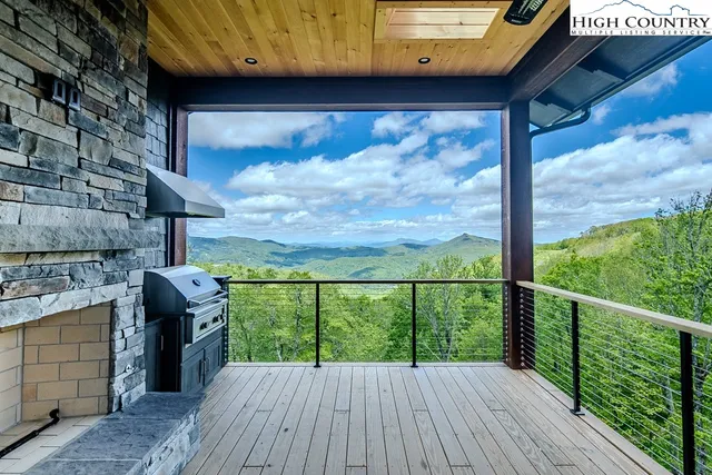a view of a porch with wooden floor