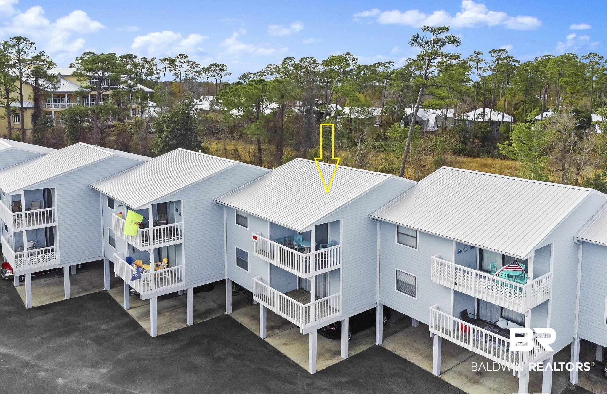 25861 Canal Road, Unit 77 Orange Beach, AL 36561 - Photo 1 of 48 Aerial perspective of suburban area