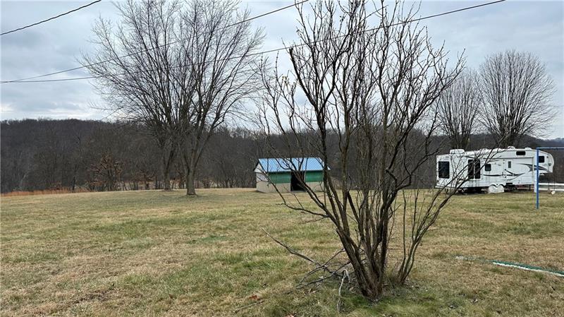 89 State Rte 908 Extension Tarentum, PA 15084 - Photo 11 of 48 a house with trees in front of it