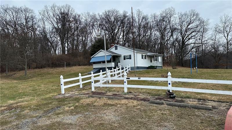 89 State Rte 908 Extension Tarentum, PA 15084 - Photo 18 of 48 a front view of a house with a yard