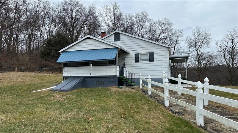 89 State Rte 908 Extension Tarentum, PA 15084 - Photo 2 of 48 a view of house with backyard and trees