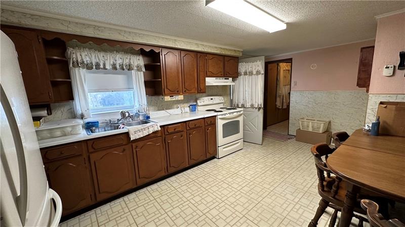 89 State Rte 908 Extension Tarentum, PA 15084 - Photo 26 of 48 a kitchen with a sink appliances and cabinets