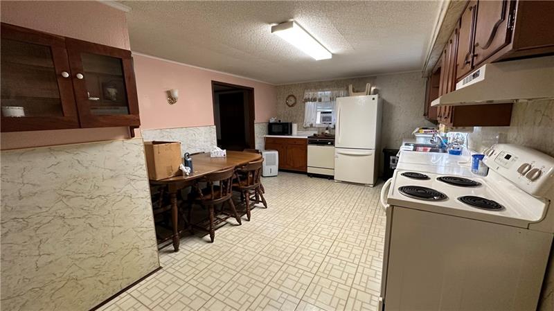 89 State Rte 908 Extension Tarentum, PA 15084 - Photo 27 of 48 a kitchen with a sink appliances and cabinets