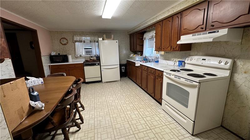 89 State Rte 908 Extension Tarentum, PA 15084 - Photo 28 of 48 a kitchen with stainless steel appliances a stove a sink dishwasher and a refrigerator