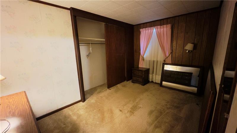 89 State Rte 908 Extension Tarentum, PA 15084 - Photo 35 of 48 a view of empty room with wooden floor and fan