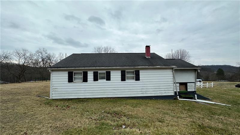 89 State Rte 908 Extension Tarentum, PA 15084 - Photo 4 of 48 a front view of a house with a yard