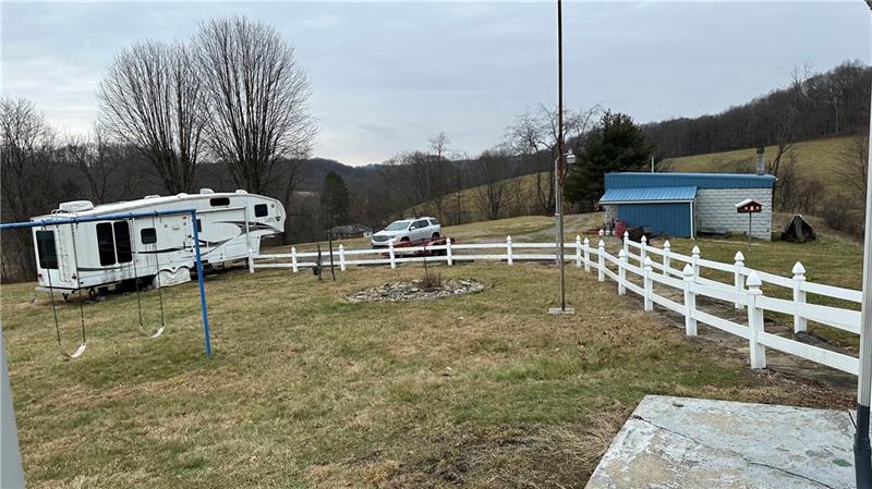 89 State Rte 908 Extension Tarentum, PA 15084 - Photo 5 of 48 a backyard of a house with table and chairs