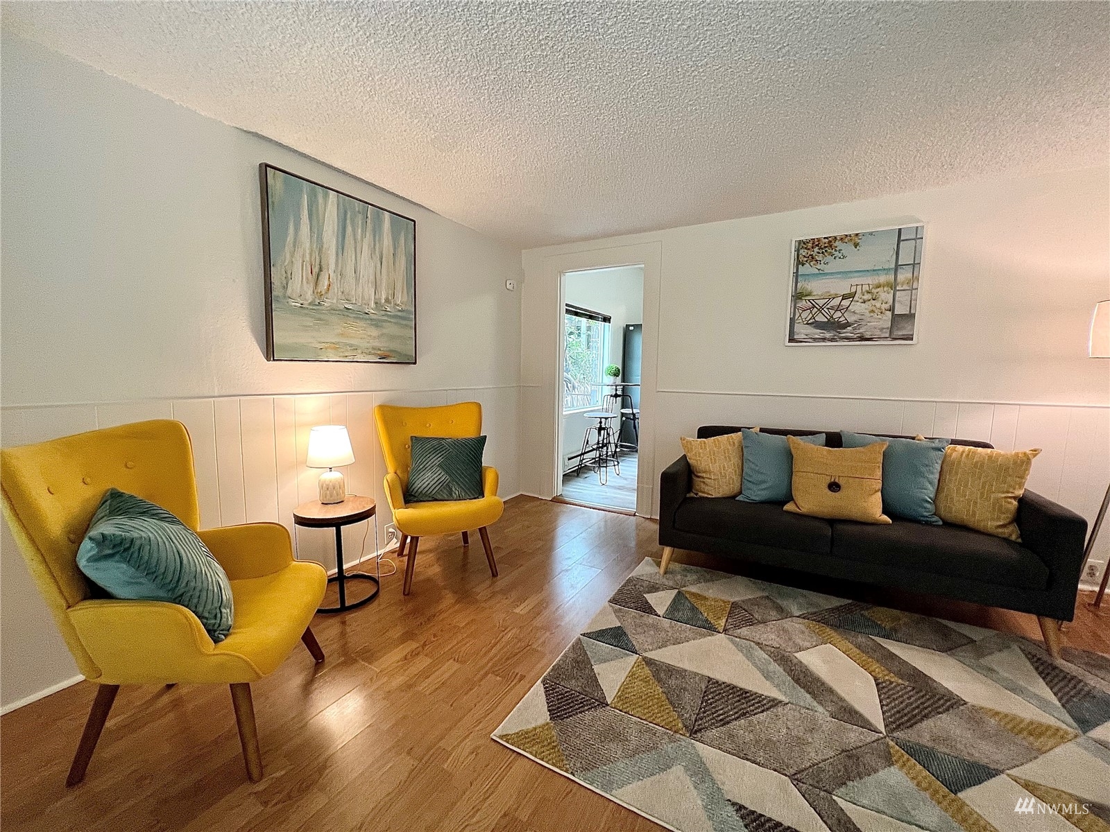 432 Cedar Avenue South Renton, WA 98057 - Photo 11 of 38 a living room with furniture and a wooden floor