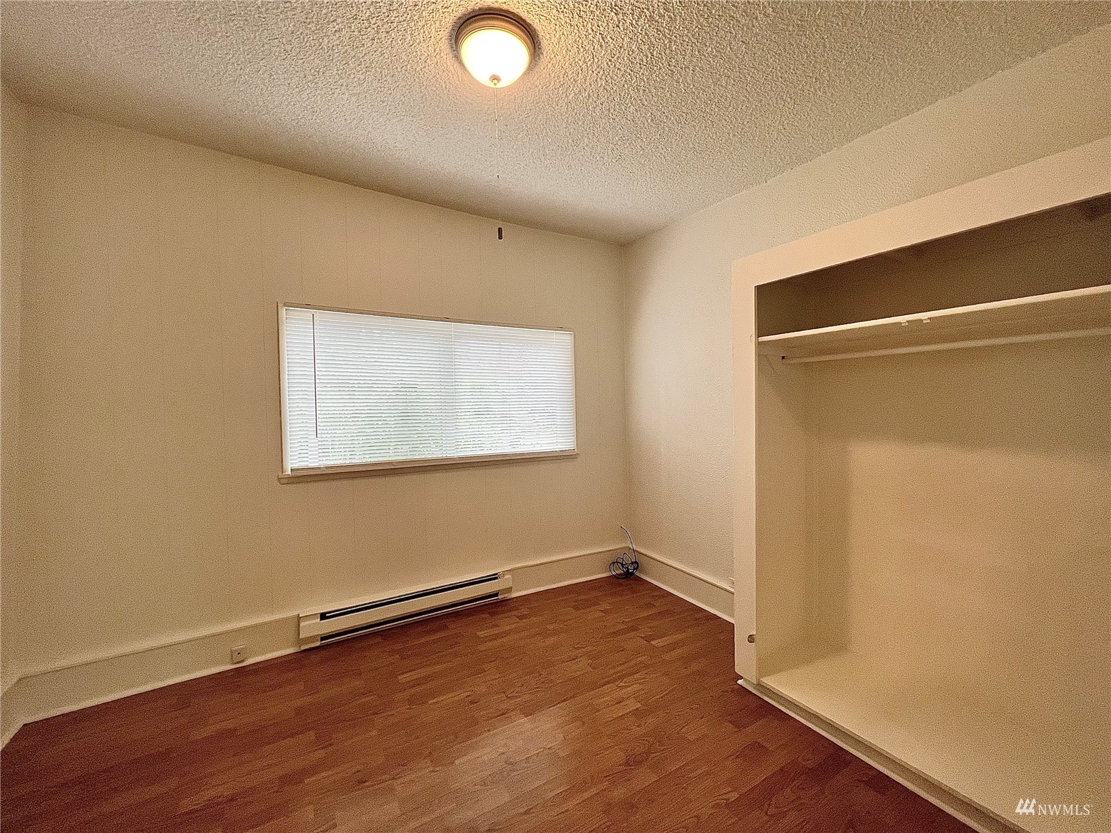 432 Cedar Avenue South Renton, WA 98057 - Photo 25 of 38 an empty room with wooden floor and windows
