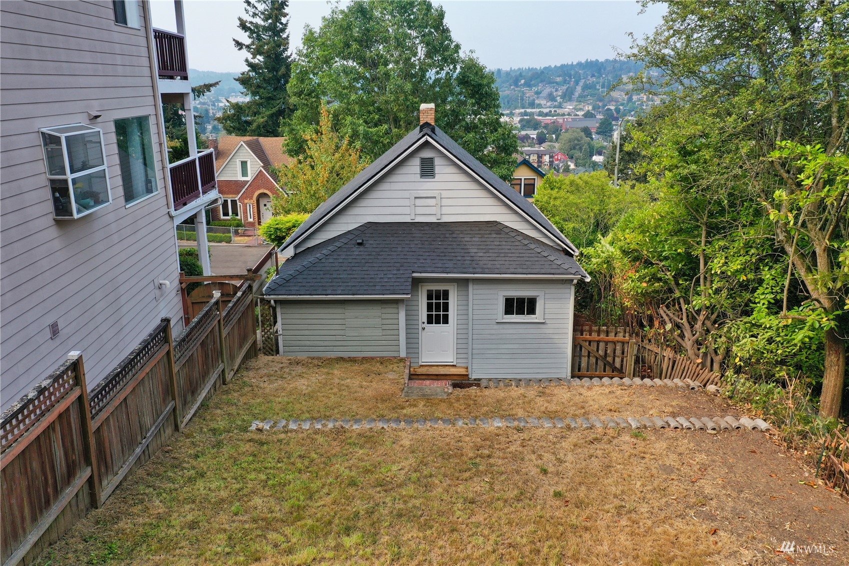 432 Cedar Avenue South Renton, WA 98057 - Photo 31 of 38 a house with trees in the background
