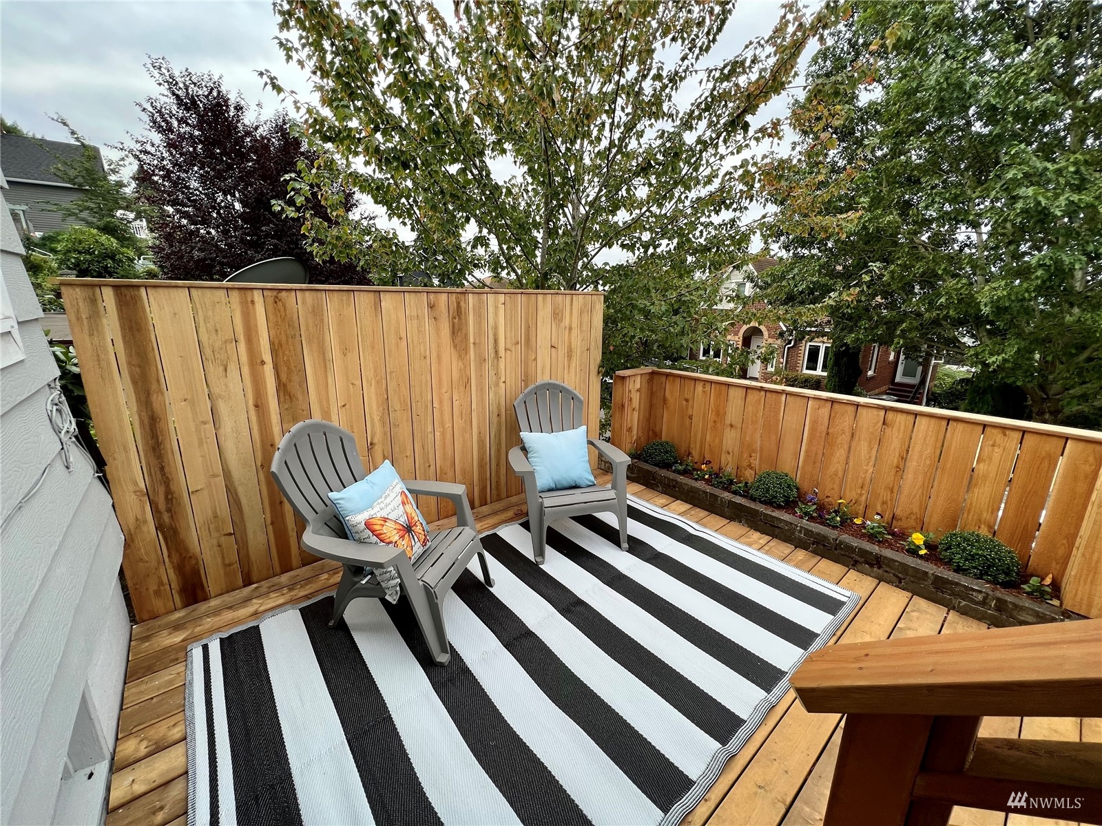 432 Cedar Avenue South Renton, WA 98057 - Photo 5 of 38 a roof deck with wooden floor and fence