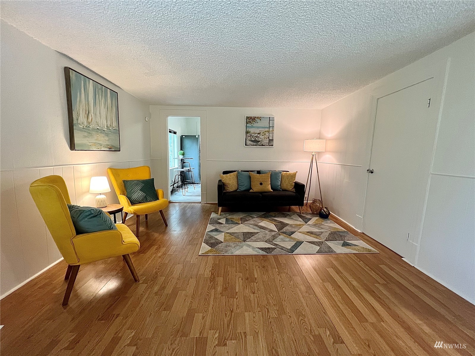 432 Cedar Avenue South Renton, WA 98057 - Photo 8 of 38 a living room with furniture and a wooden floor