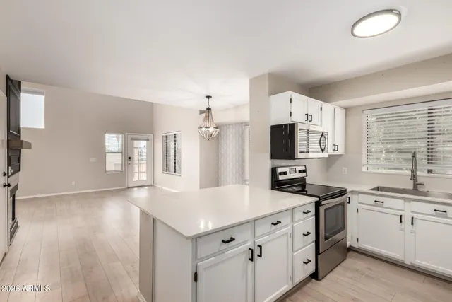 a view of a hallway with washer and dryer