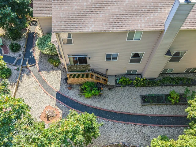 a view of a pathway with a house in the background