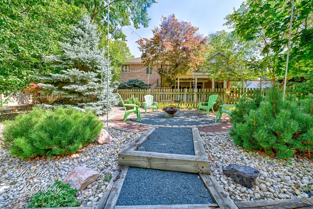 a view of a house with a yard and garage