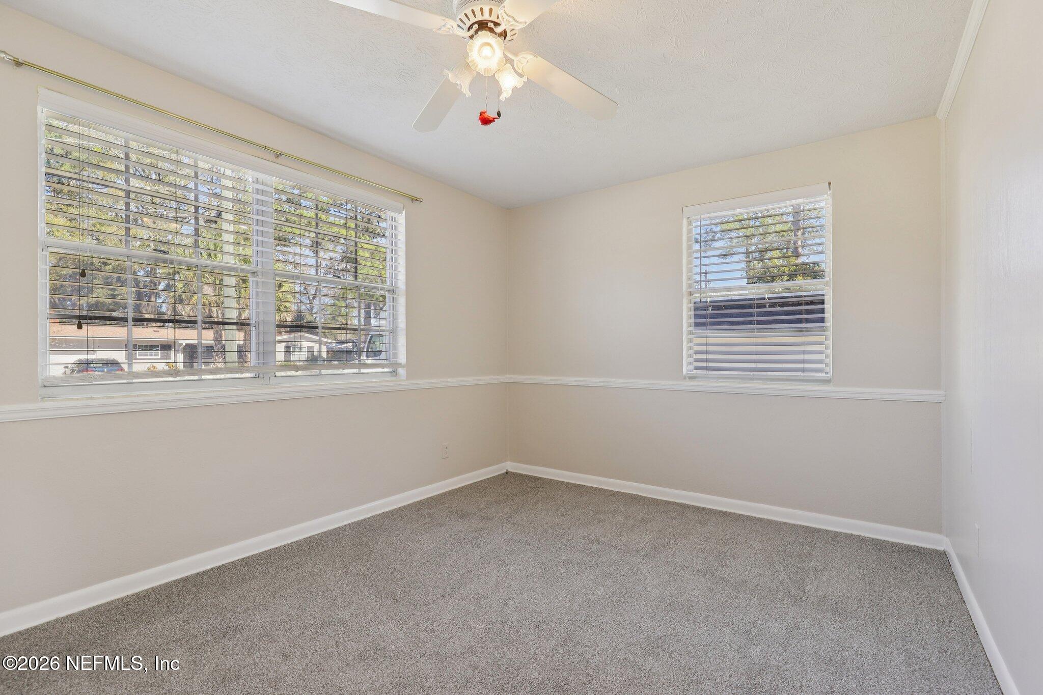 7004 Waikiki Road Jacksonville, FL 32216 - Photo 15 of 41 an empty room with a window