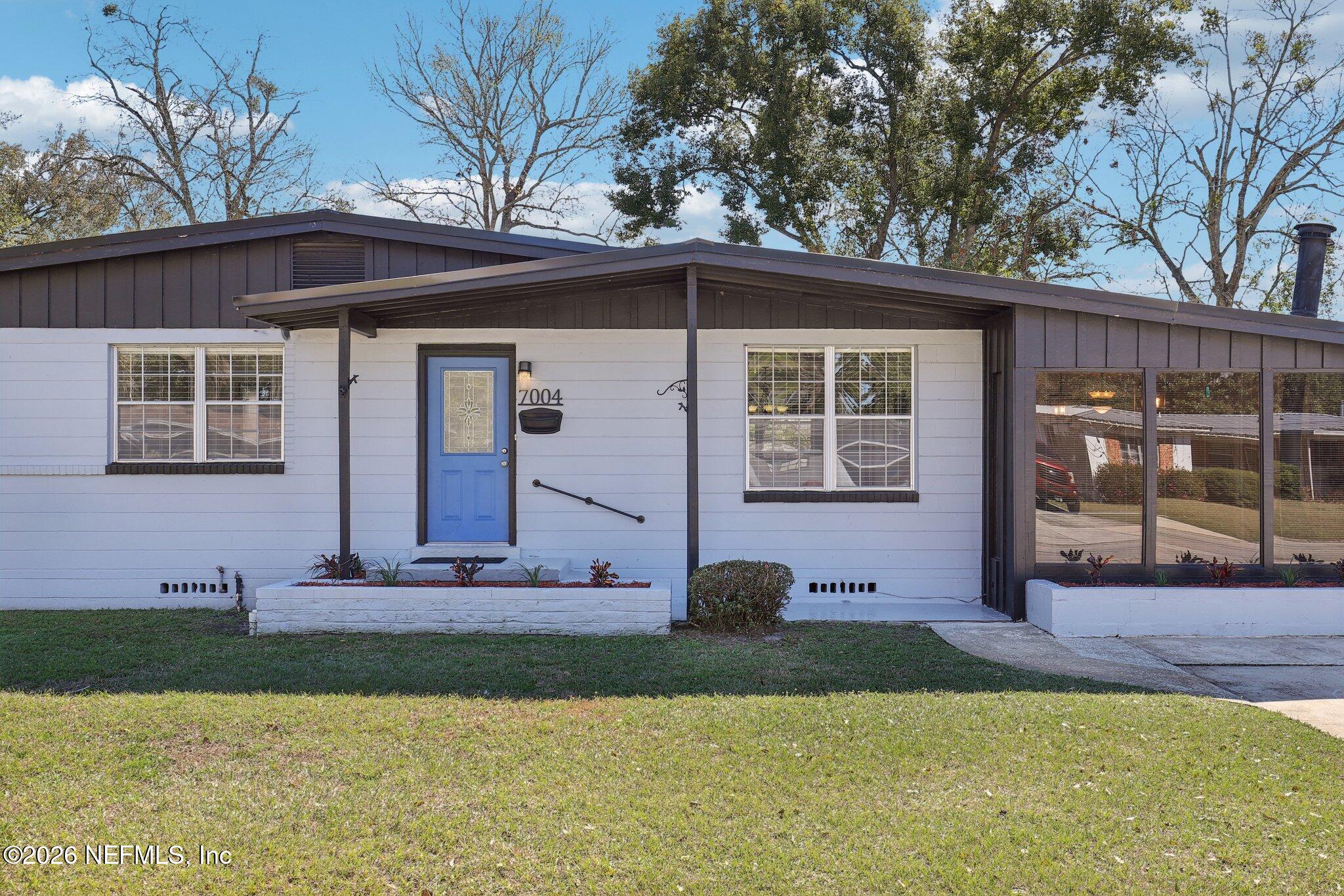 7004 Waikiki Road Jacksonville, FL 32216 - Photo 20 of 41 a front view of a house with garden