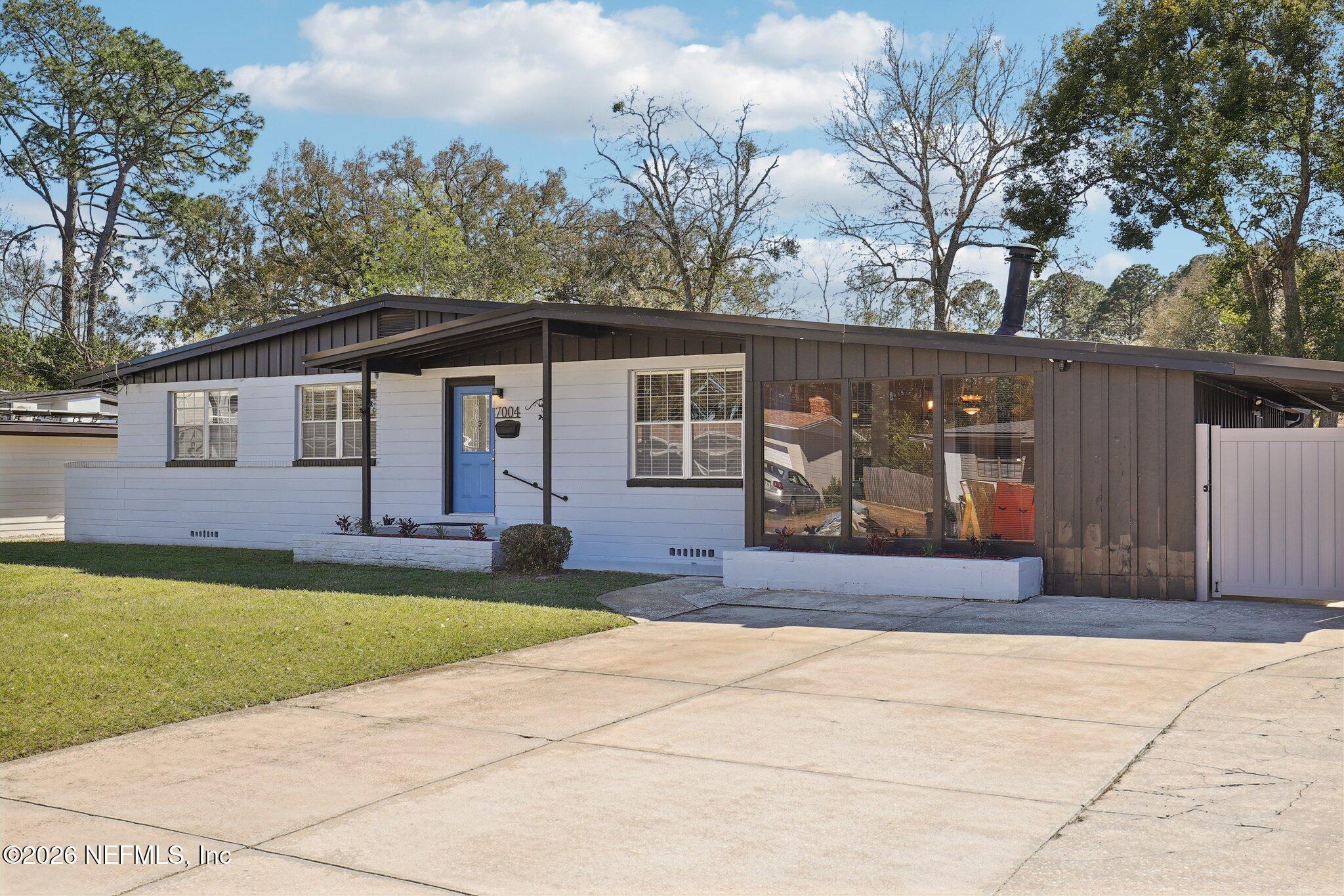 7004 Waikiki Road Jacksonville, FL 32216 - Photo 21 of 41 a front view of a house with garden