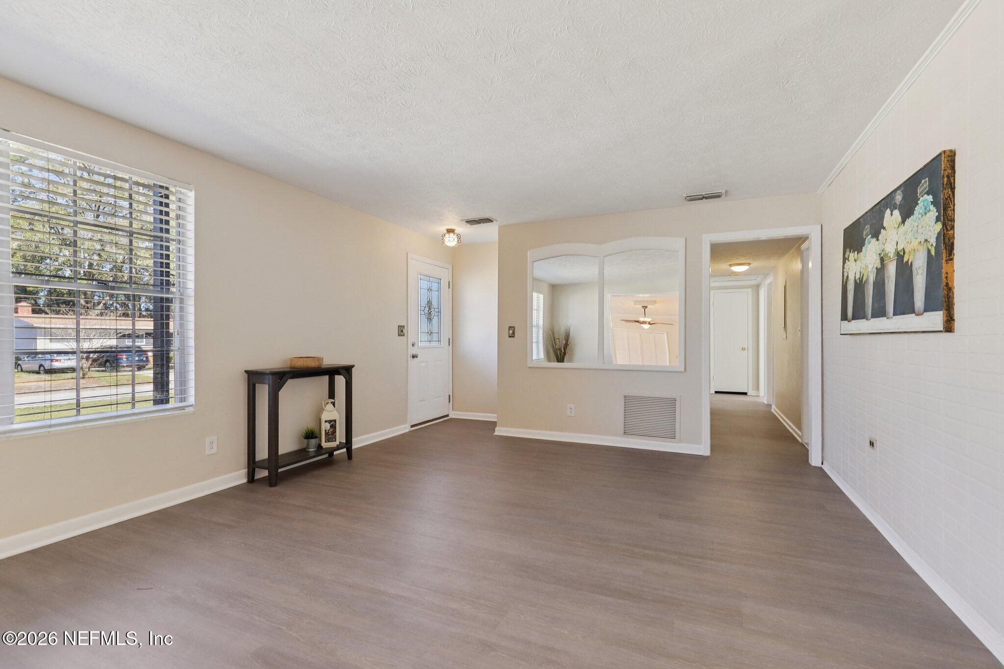 7004 Waikiki Road Jacksonville, FL 32216 - Photo 22 of 41 a view of an empty room with a window