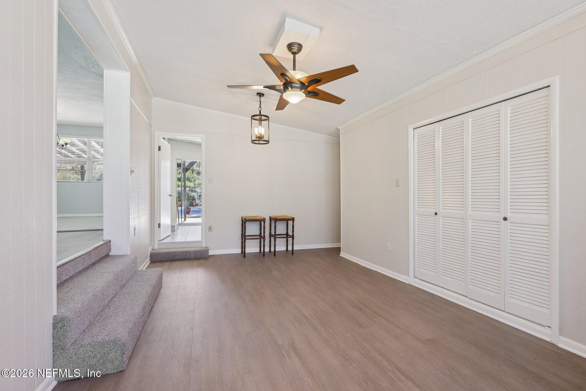 7004 Waikiki Road Jacksonville, FL 32216 - Photo 25 of 41 wooden floor in an empty room with a window