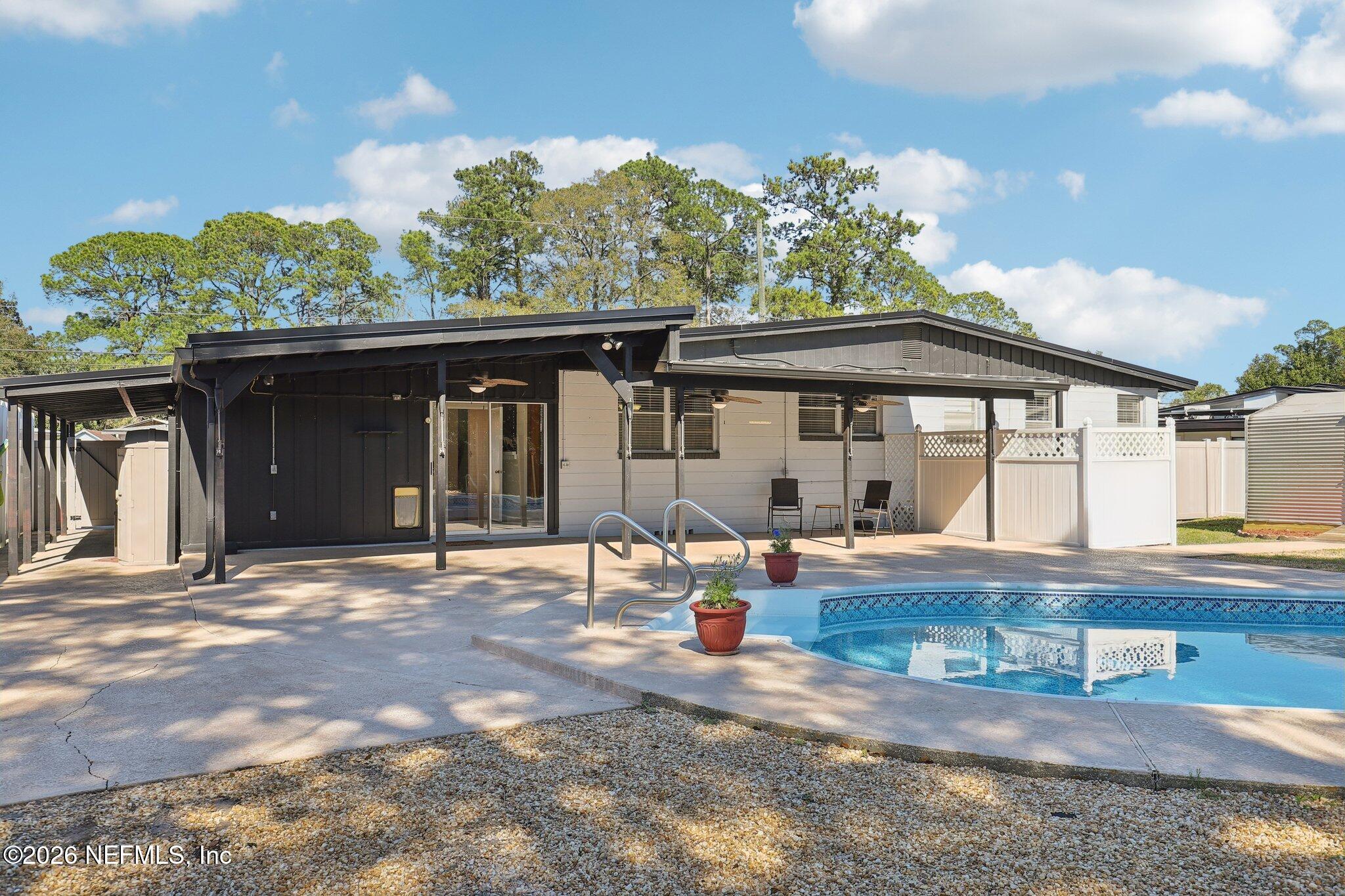 7004 Waikiki Road Jacksonville, FL 32216 - Photo 38 of 41 a front view of a house with porch