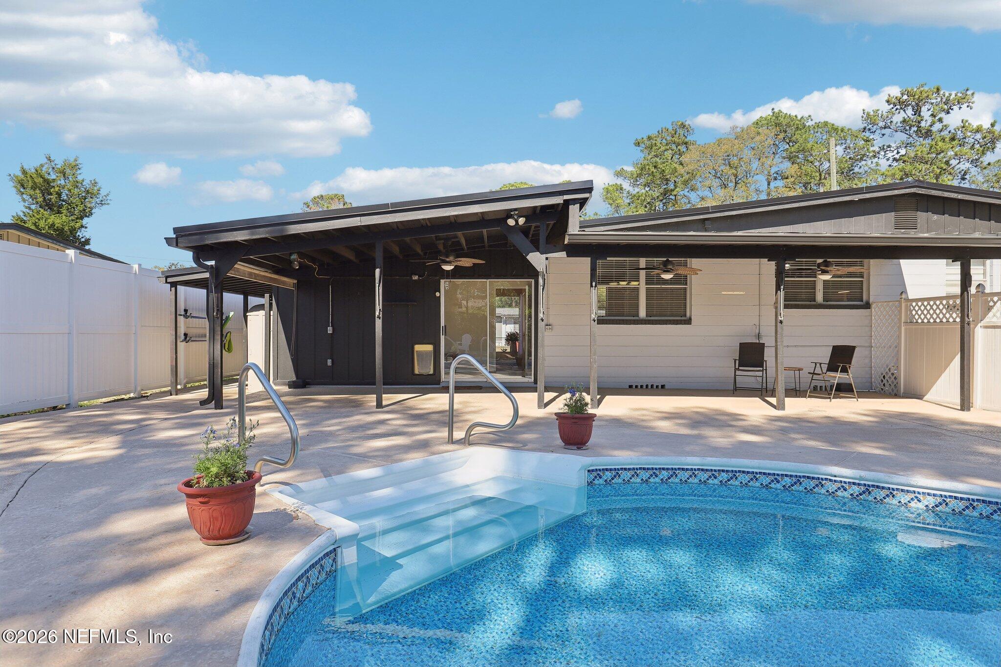 7004 Waikiki Road Jacksonville, FL 32216 - Photo 39 of 41 a view of a house with backyard and sitting area