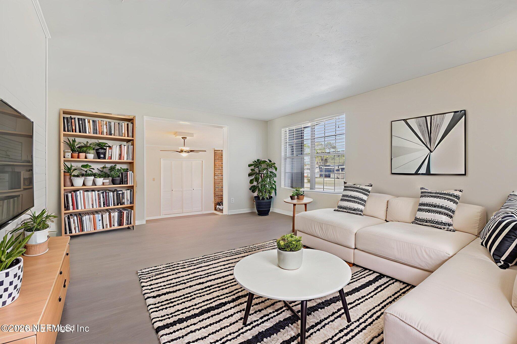 7004 Waikiki Road Jacksonville, FL 32216 - Photo 4 of 41 a living room with furniture and a wooden floor