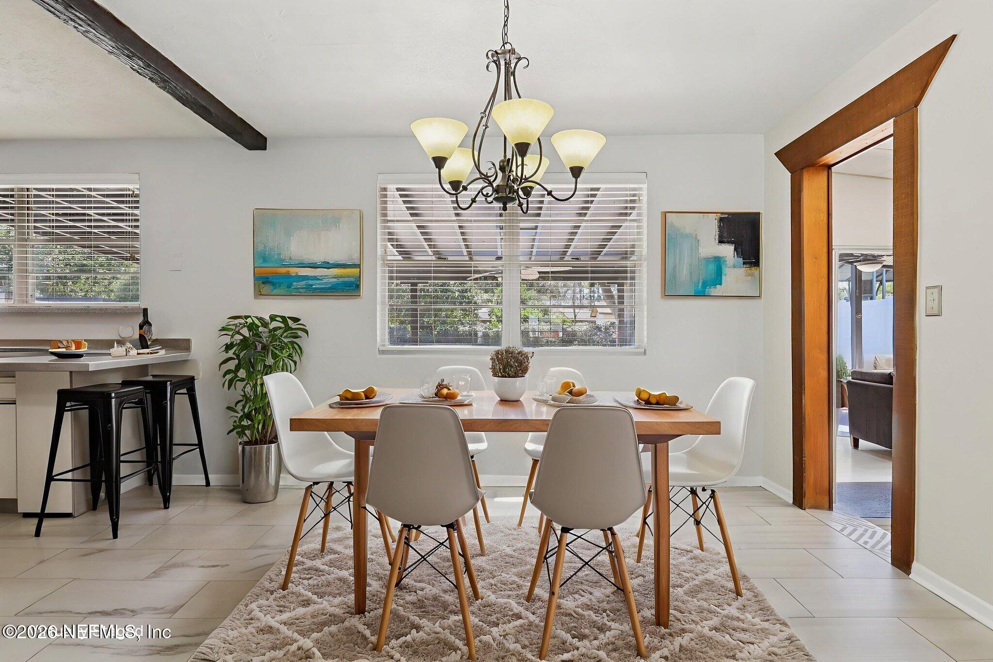 7004 Waikiki Road Jacksonville, FL 32216 - Photo 6 of 41 a view of a dining room with furniture window and outside view
