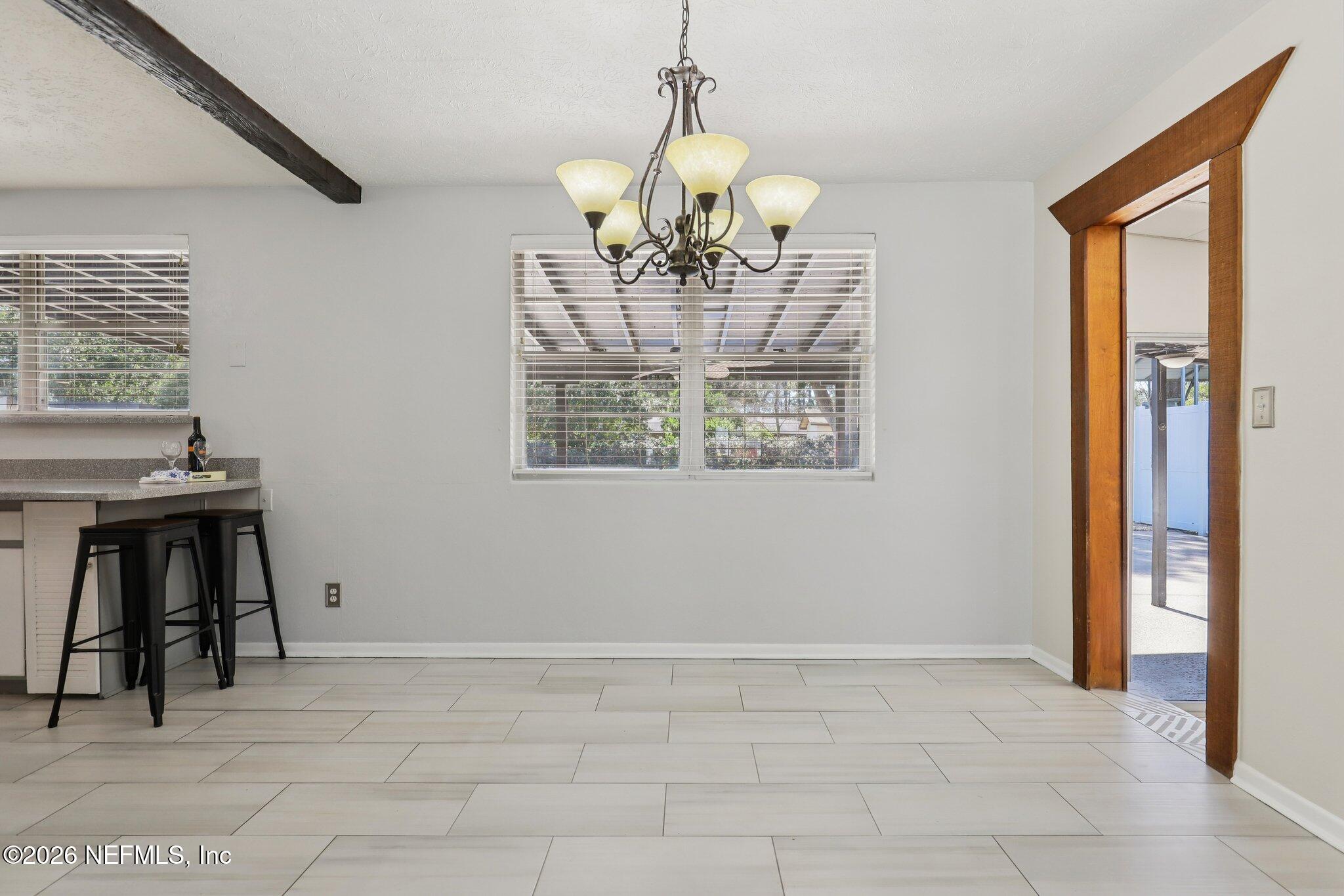 7004 Waikiki Road Jacksonville, FL 32216 - Photo 7 of 41 a view of an empty room with window