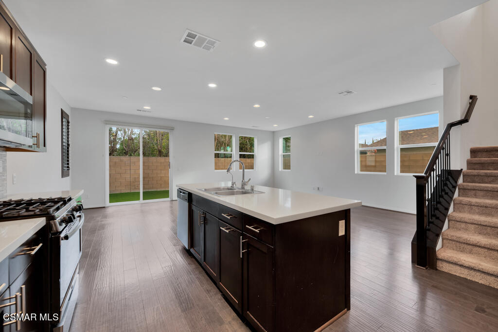 8600 Rivendell Court Winnetka, CA 91306 - Photo 3 of 49 a kitchen with a sink and stove top oven