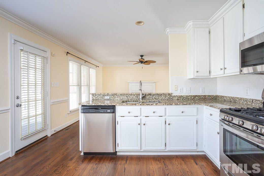 2409 Dahlgreen Road Raleigh, NC 27615 - Photo 14 of 30 a kitchen with granite countertop white cabinets and a stove
