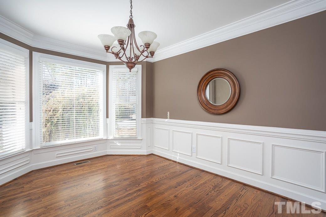 2409 Dahlgreen Road Raleigh, NC 27615 - Photo 3 of 30 a room with wooden floor and windows